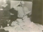 Charles Schenk examines entries from the   name the beer   contest in 1939